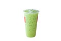 Iced matcha latte or green milk tea in plastic glass isolated on white background Royalty Free Stock Photo