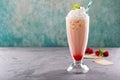 Iced milkshake with raspberry syrup and whipped cream Royalty Free Stock Photo