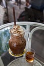 Iced mocha coffee with whip cream topping and syrup