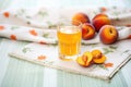 iced tea with apricot halves, fresh apricots on cloth Royalty Free Stock Photo