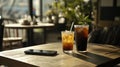 Iced Coffee and Smartphone on a. Royalty Free Stock Photo