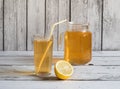 Iced tea in a clear plastic cup. Kombucha drink