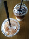 Iced tea and latte on wood table