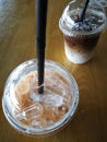 Iced tea and latte on wood table