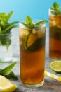 Iced tea with lemon, lime summer cold fruit drink with mint leaves Royalty Free Stock Photo