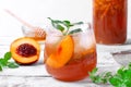 Iced tea with nectarines in drinking glass Royalty Free Stock Photo