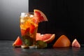 Iced tea or a summer refreshing drink with ice, mint, and grapefruit