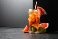 Iced tea or a summer refreshing drink with ice, mint, and grapefruit