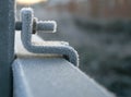 Iced up nut and bolt on frozen railing