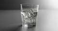 Iced Water in Clear Glass with Shadow on Gray Background Still Life Royalty Free Stock Photo