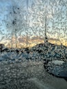 Iceflowers, frozen.The ice-cold frost forms ice crystals in beautiful unique patterns on the window, Hood and wiper on the Car Royalty Free Stock Photo