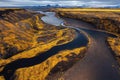 Iceland aerial river flowing between desert rocky shores