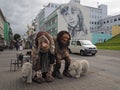 Two trolls and polar bears figurine on main street downtown Akureyri city center Iceland