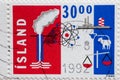 ICELAND- CIRCA 1992: a postage stamp printed in Iceland shown Industry, agriculture and atomic symbols like atomic power plant, ch
