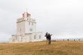 Iceland, dyrhÃÂ³laey lighthouse, young couple Royalty Free Stock Photo