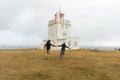 Iceland, dyrhÃÂ³laey lighthouse, young couple Royalty Free Stock Photo