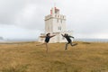 Iceland, dyrhÃÂ³laey lighthouse, young couple Royalty Free Stock Photo