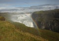 Iceland green lanscape waterfall with a Rainbow