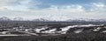 Iceland highlands autumn ultrawide view. Lava fields of volcanic sand in foreground. Hrauneyjalon lake and volkanic snow covered
