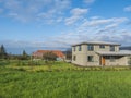 Iceland, Hveragerdi, August 5, 2019: Building of family houses with greenhouse in peaceful tranquil Iceland landscape with lush