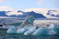 Iceland iceberg in JÃ¶kulsÃ¡rlÃ³n glacier lagoon with VatnajÃ¶kull National Park in the background