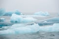 Iceland Lake with Melting Glaciers in Foggy Weather, Pure Blue Ice in Jokulsarlon lagoon. Royalty Free Stock Photo