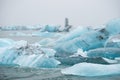 Iceland Lake with Melting Glaciers in Foggy Weather, Pure Blue Ice in Jokulsarlon lagoon. Royalty Free Stock Photo