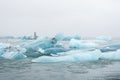 Iceland Lake with Melting Glaciers in Foggy Weather, Pure Blue Ice in Jokulsarlon lagoon. Royalty Free Stock Photo