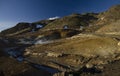 Fumarole fields of Iceland covered with yellow brimstone with boiling mud craters against the winter sky Royalty Free Stock Photo