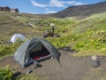 ICELAND, LANDMANNALAUGAR, August 1, 2019: Open green tent and hikers gear at Botnar campsite on Laugavegur hiking trail