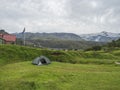 ICELAND, LANDMANNALAUGAR, August 1, 2019: Open green tent and mountain hut Skagfjordsskali and Langidalur camping site