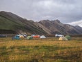 Iceland, Landmannalaugar , July 30, 2019: view on landmannalaugar camp site with cars, tents, tourists and hikers on