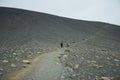 Iceland landscape. Clambering into a volcano, Long path to a scenic crater edge. Royalty Free Stock Photo