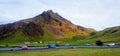 Iceland mountain landscape sky clouds cliff green morning yellow car