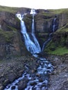 Landscape of a trio of waterfalls making a small stream