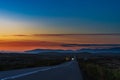 Iceland road at blue hour. Evening, cloudless sky and a good view into the deep distance.