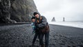 Iceland senior couple tourist at black beach Royalty Free Stock Photo