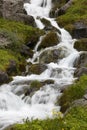 Iceland. Seydisfjordur. Waterfall and basaltic rocks.