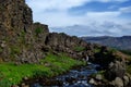 Wall of rocks and little creek was found in Thingvellir National Park in Iceland.