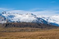 Icelandic countryside landscape with farms, mountains and Vatnajokull glacier