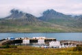 Icelandic fishing boats in the morning at the dock in the fjord in calm weather in summer Royalty Free Stock Photo