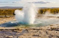 Icelandic Geyser Strokkur. Great tourist attraction on Golgen Circle Iceland. Vsible geyser valley