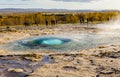 Icelandic Geyser Strokkur. Great tourist attraction on Golgen Circle Iceland. Vsible geyser valley