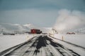 Icelandic landscape with geothermal power plant station kravla with igloo huts and pipes in the valley. Myvatn lake Royalty Free Stock Photo