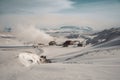 Icelandic landscape with geothermal power plant station kravla with igloo huts and pipes in the valley. Myvatn lake Royalty Free Stock Photo