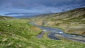 Icelandic landscape on peninsula Skagi with a river an the Tindastoll mountains