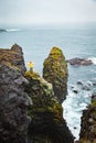 Icelandic landscape, person in yellow rain jacket. Iceland.