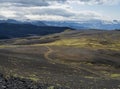 Icelandic lava desert landscape with view on Tindfjallajokull glacier and bending footpath. Fjallabak Nature Reserve Royalty Free Stock Photo