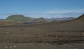 Icelandic lava desert landscapel with view on Tindfjallajokull glacier mountains and green hills. Fjallabak Nature Royalty Free Stock Photo