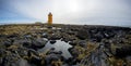 Icelandic lighthouse orange on a beautiful cliff